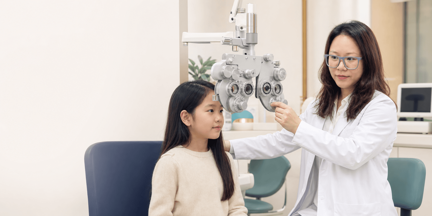 Doctor Lyna conducting a routine eye examination for a young patient